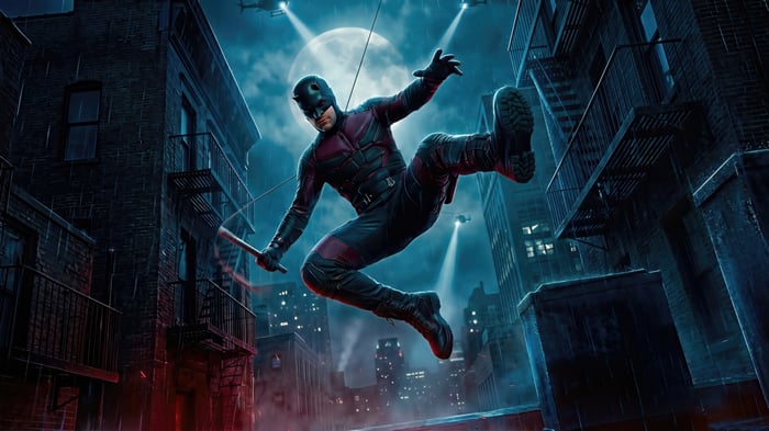 Daredevil in a dark, rainy city at night