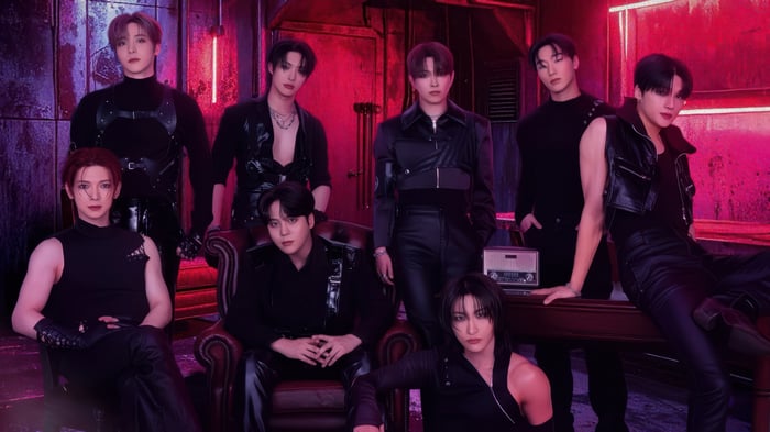 ATEEZ members in dark outfits with red lighting