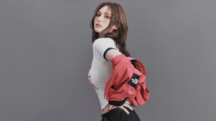 Jeon Somi in a red jacket and white t-shirt