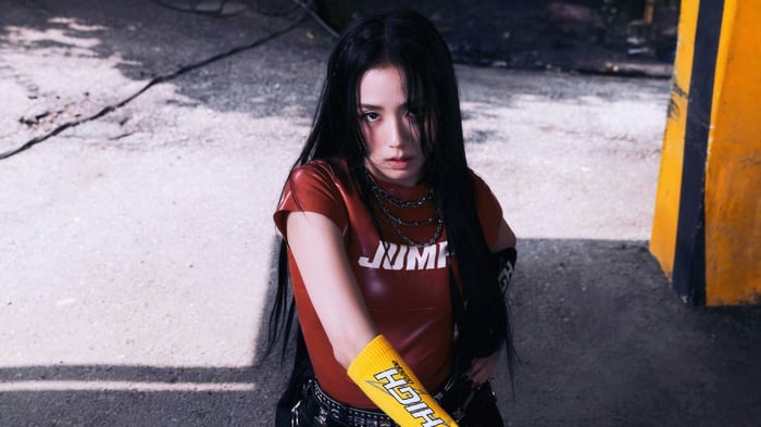 Jisoo from BLACKPINK in a red shirt