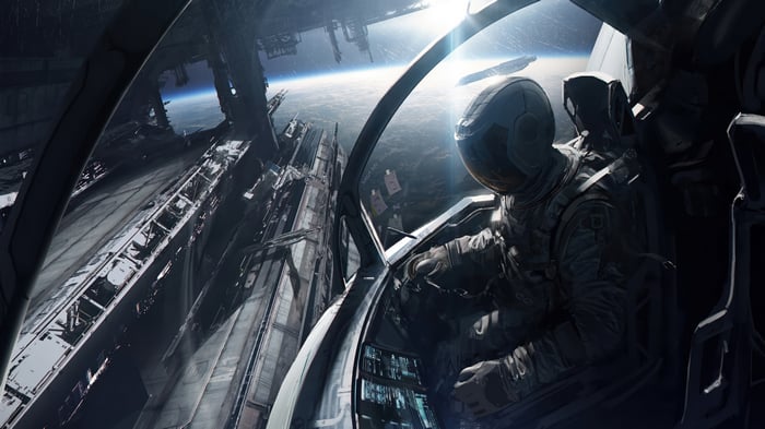Astronaut in a spaceship cockpit overlooking Earth