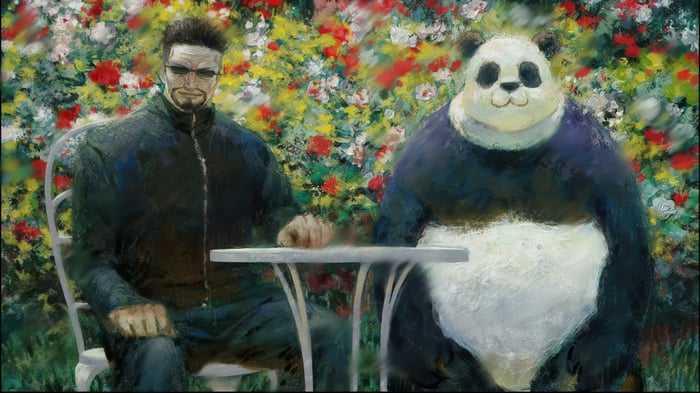 Panda and man sitting at a table with flowers