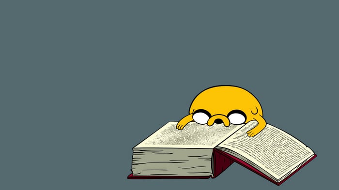 Jake from Adventure Time reading a book