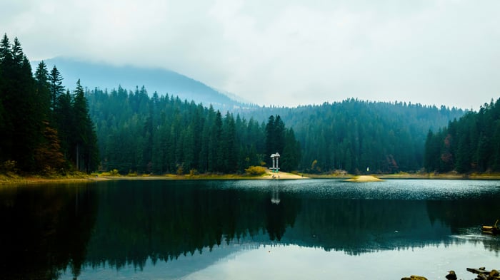 Lake and forest scenery with a gazebo