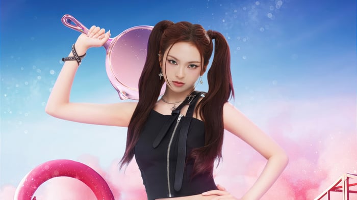 Chiquita from BABYMONSTER holding a frying pan