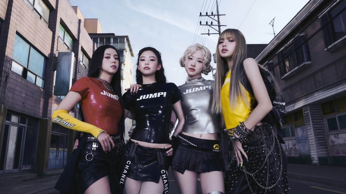 BLACKPINK members Jisoo, Jennie, Rosé, and Lisa in urban setting