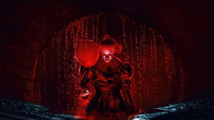 Pennywise with a red balloon in a sewer 4K