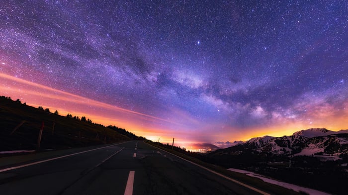 Starry Night Sky Over a Mountain Road