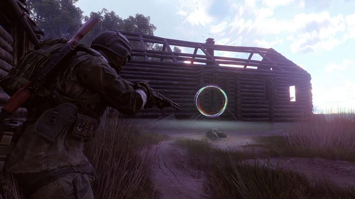 Video game character with rifle near ruined building