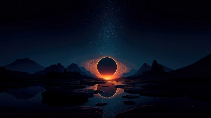 Night sky with a ringed planet over mountains and water