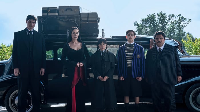 The Addams Family Poses in Front of a Car