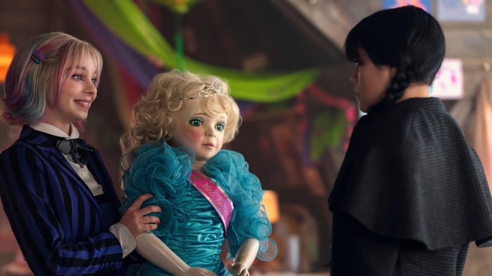 Enid Sinclair and Wednesday Addams with a doll