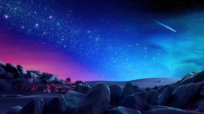 Night Sky with Stars and Comet over Rocky Landscape 4K