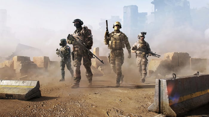 Four soldiers in a war-torn environment