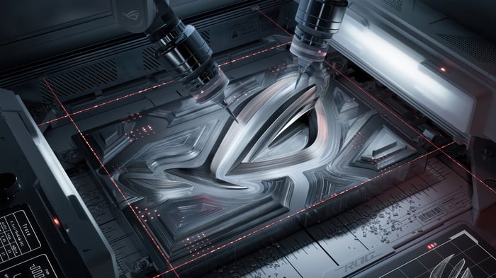 ASUS ROG logo being manufactured by robotic arms