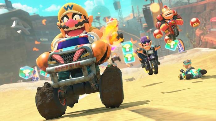 Mario Kart 8 Deluxe: Wario races in a desert track