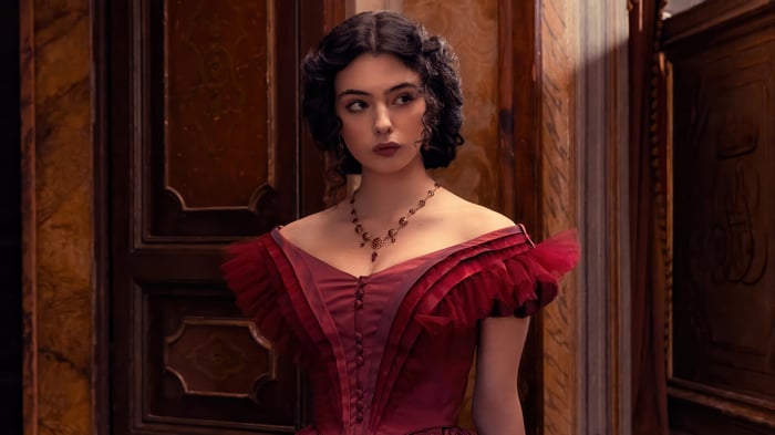 Deva Cassel in a red dress