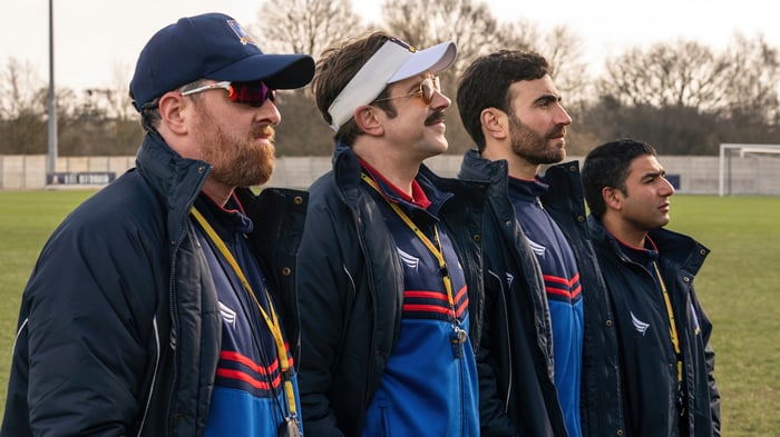 Ted Lasso and his coaching staff on a field