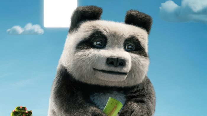 Panda holding bamboo in front of a bright square