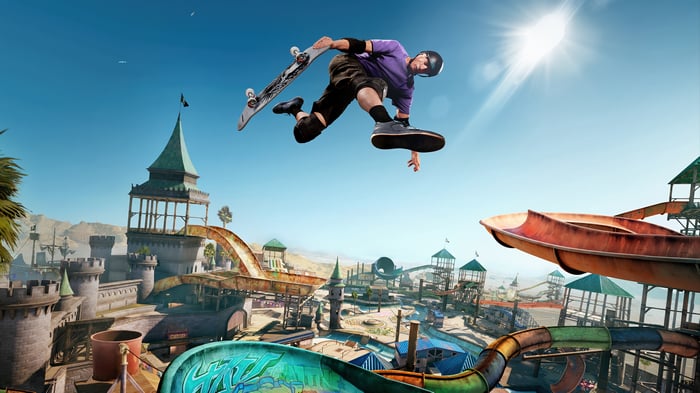 Skateboarder performing a trick in a water park