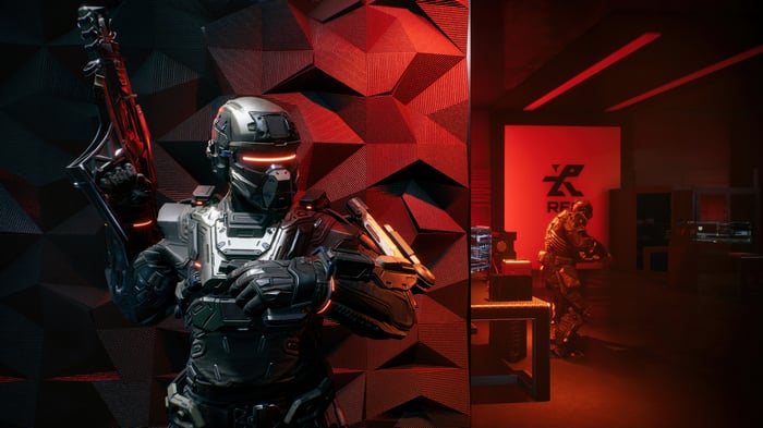 La Quimera soldier with futuristic rifle in red room