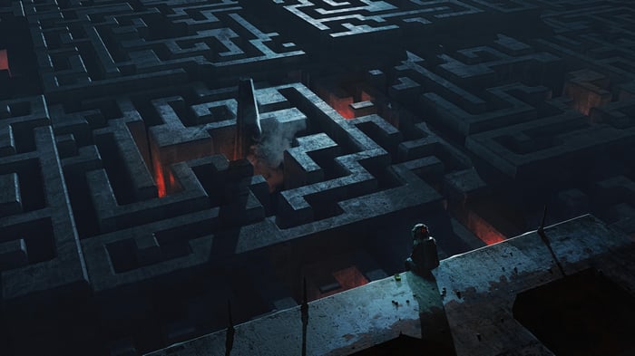 Man sitting in a dark, glowing maze 4K