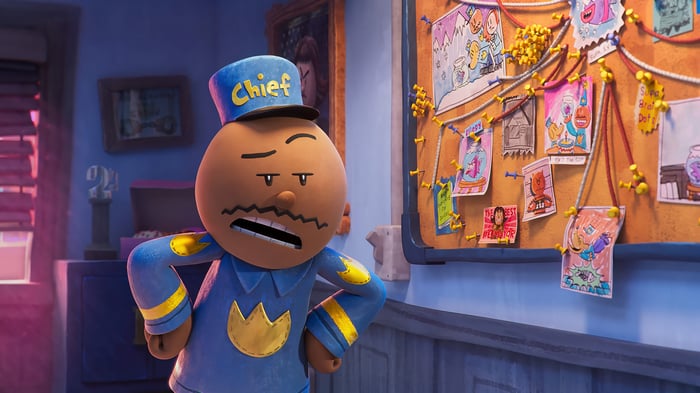 Dog Man Chief Looking at a Bulletin Board