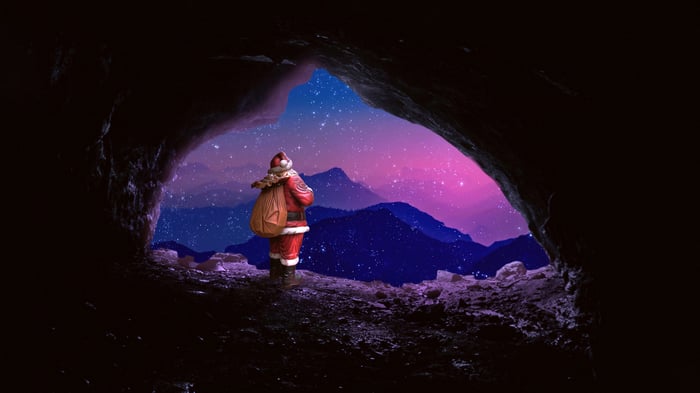 Santa Claus with a gift bag in a cave