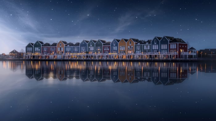 Colorful houses reflected in water at night, Netherlands 4K