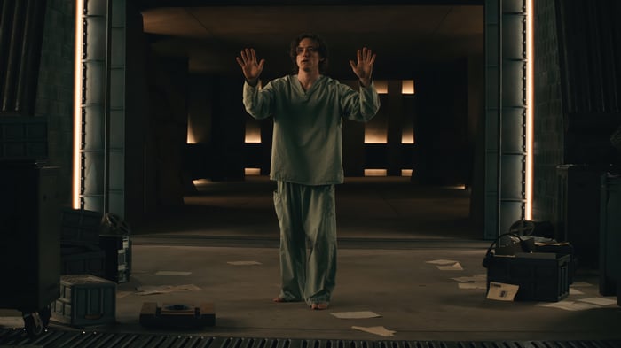 Sentry in a dark, futuristic room