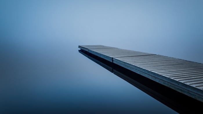 Wooden dock on a calm lake in 4K