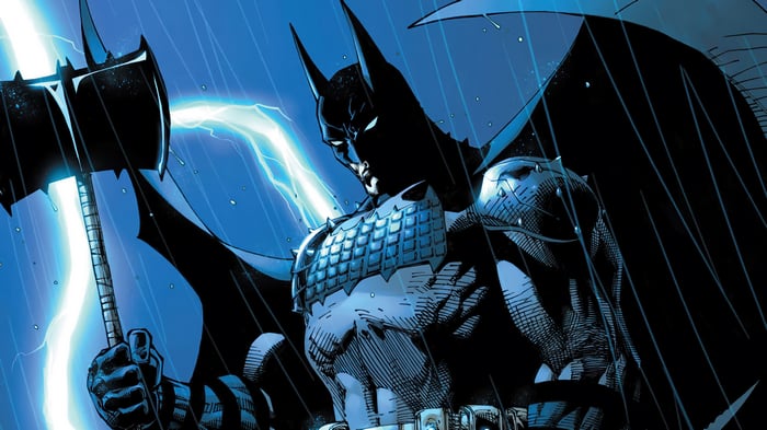 Batman holding an axe in the rain