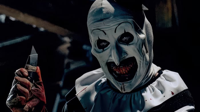 Art the Clown from Terrifier holding a knife