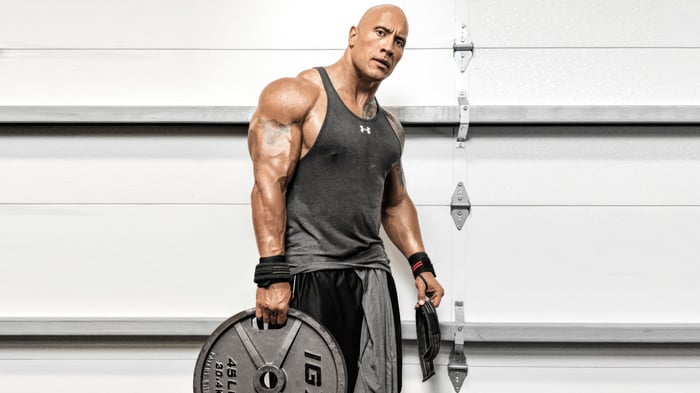Dwayne Johnson in a gym with weight plates