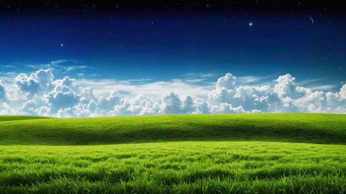 Green Field Under a Starry Sky with Clouds