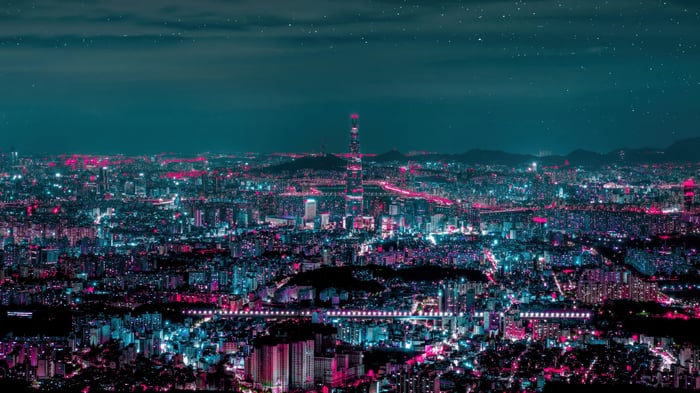 Cityscape at Night with Tall Buildings and Stars