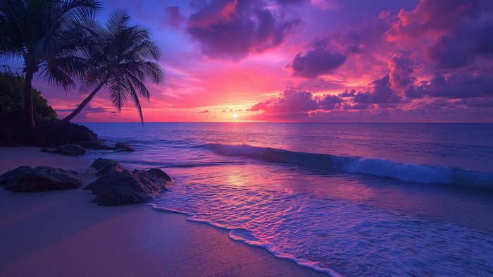 Beach sunset with palm trees and ocean waves