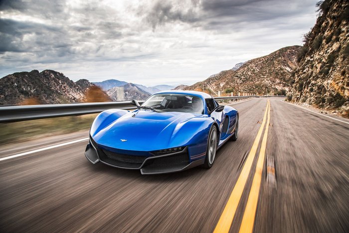 Blue 2017 Rezvani Beast Alpha driving on a mountain road
