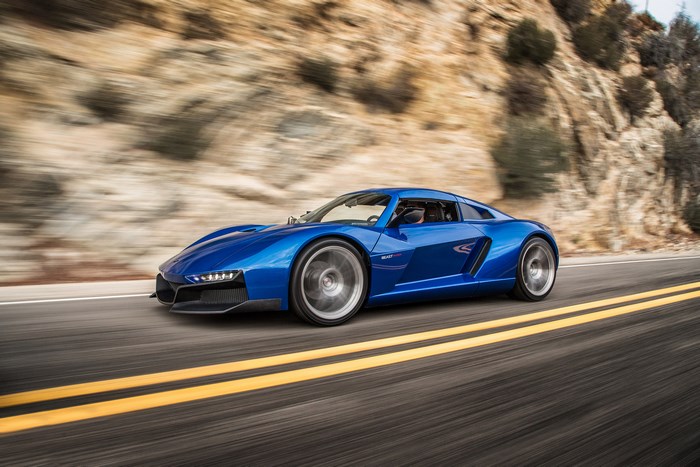 2017 Blue Rezvani Beast Alpha driving on a road
