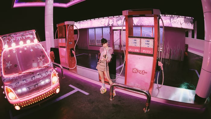 Aespa Karina at a pink gas station