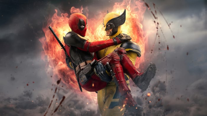 Deadpool Carries Wolverine Amidst Flames
