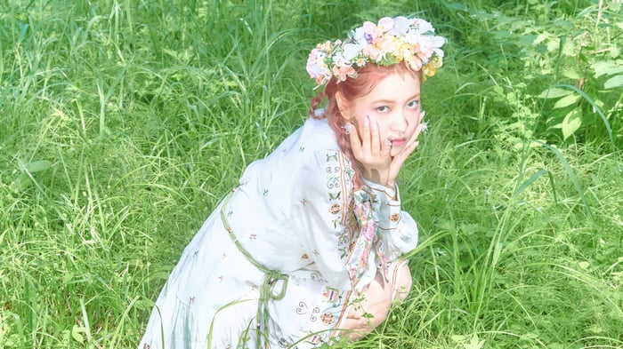 Yeri from Red Velvet in a field of grass