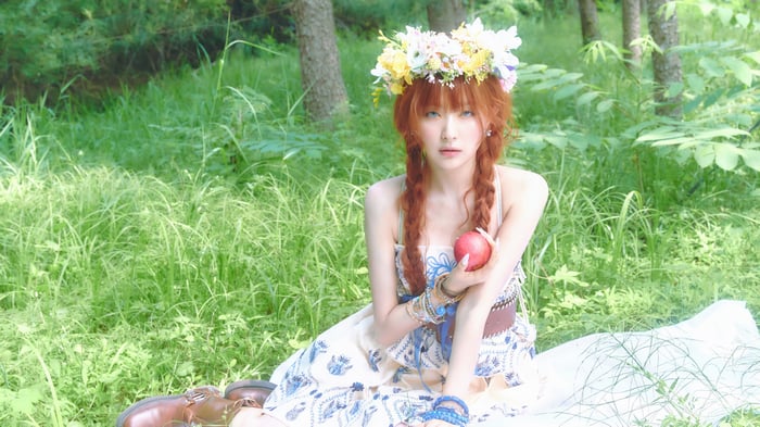 Seulgi wearing a flower crown in a forest