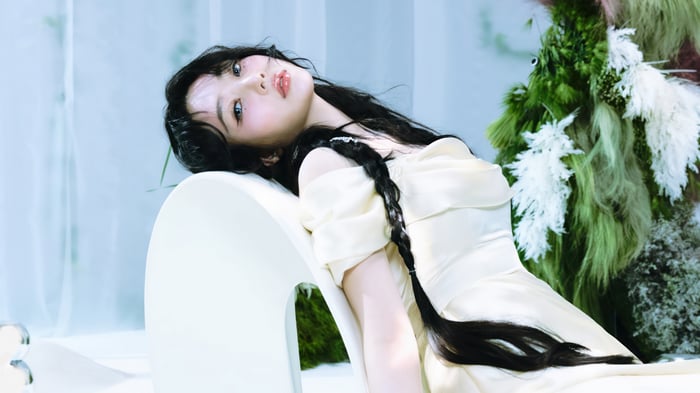 Joy from Red Velvet in a pale yellow dress