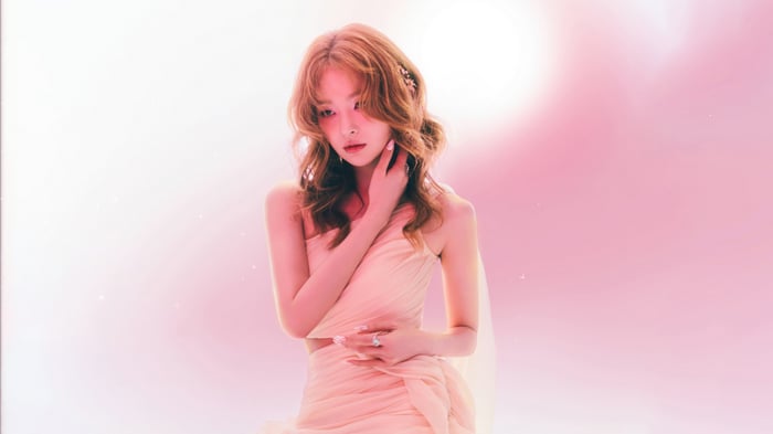 Seulgi in a flowing pink dress with floral accents