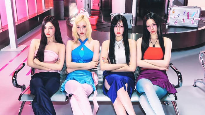 Aespa members Ningning, Winter, Giselle, and Karina posing