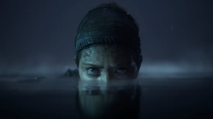 Woman emerging from dark water