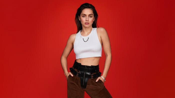 Ana de Armas in white crop top and leather harness