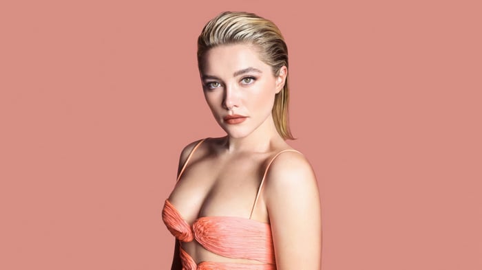 Florence Pugh in a peach dress