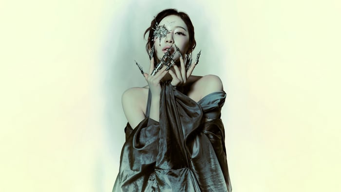 Ningning Aespa in dark gown with metallic accessories
